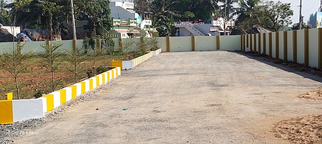 Green Leaves Gated Community residential plots site view boundry walls and internal roads are constructed. As per RERA guidlines.