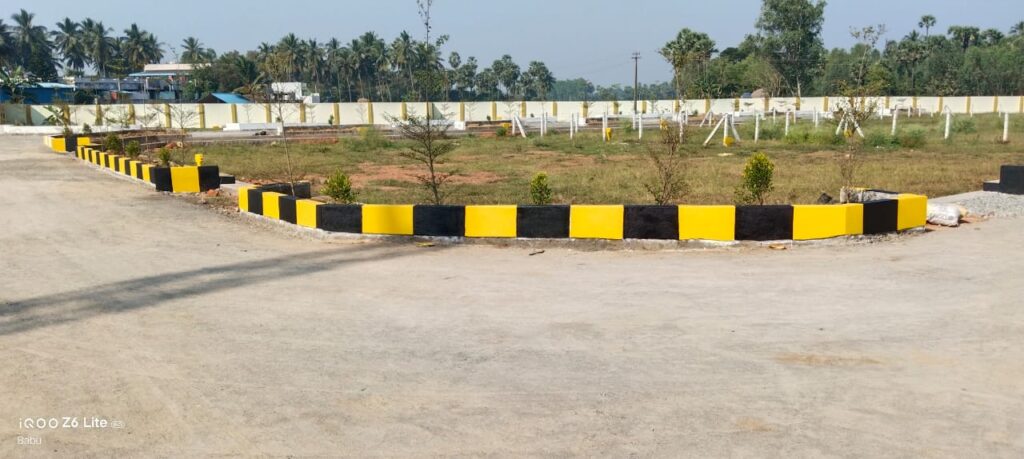 Lavanya Lahari Group Green Leaves Gated Community residential plots for sale in Dakamarri.  Electric lines are also lied in the site.